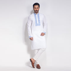 Man wearing a white panjabi with blue embroidery on a white background