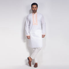 Man wearing a traditional white panjabi with a light pink collar on a white background