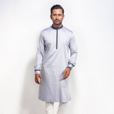 Man wearing a Light Ash panjabi with red details on a white background