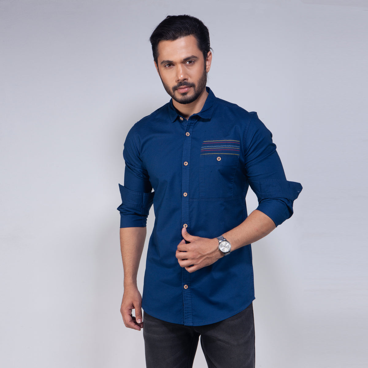 Man wearing a blue shirt on a white background