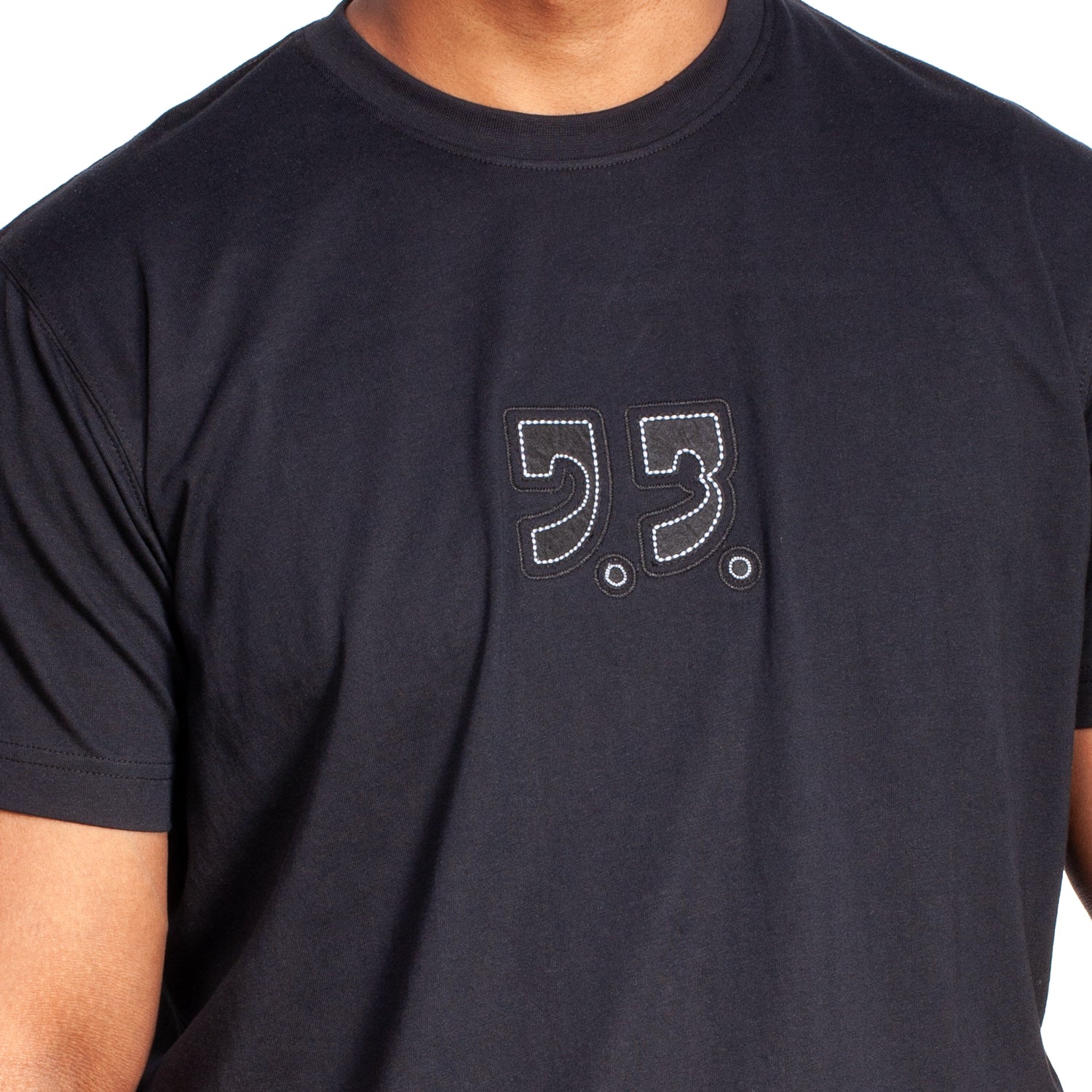 Black t-shirt with a logo on the chest against a white background