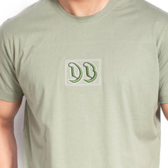 Green t-shirt with a logo on a white background