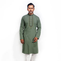 Man wearing a green kurta with white pants on a white background