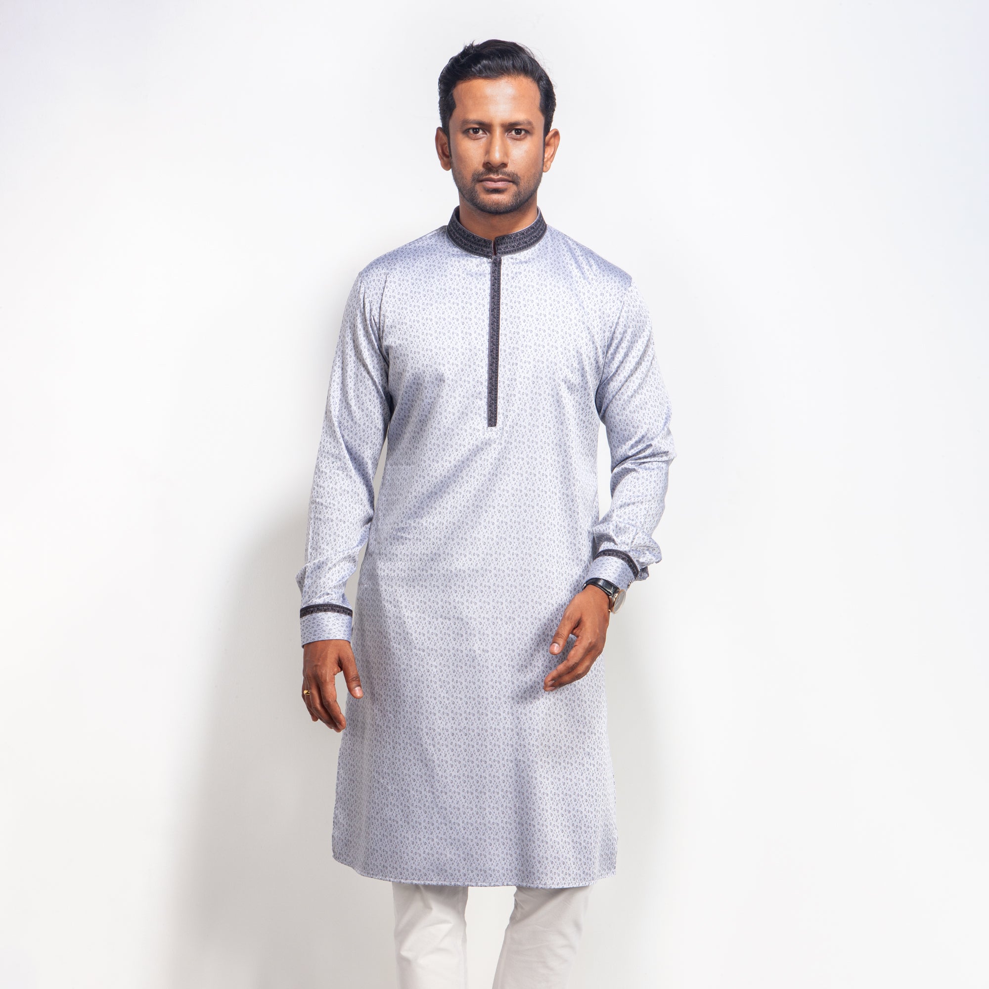 Man wearing a Light Ash panjabi with red details on a white background